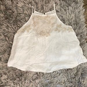 White strappy blouse with tan flower detailing